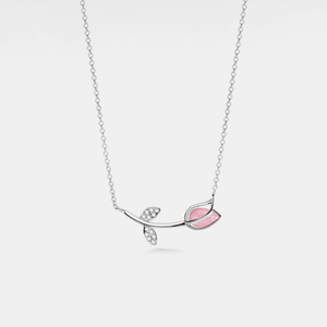 A white gold-plated necklace with a solid 925 sterling silver chain and a charm featuring a tulip flower with rose quartz petals and cubic zirconia accents.