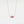 Gold necklace with a pink flower pendant on a white background