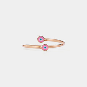 Rose gold ring with pink evil eye charms on a light gray background