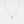 Necklace with a small round pendant on a light gray background