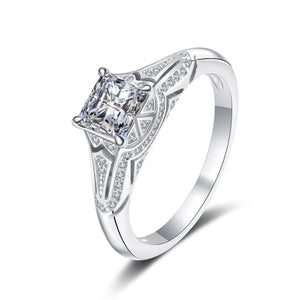 Silver ring with a diamond on a white background