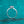 Silver ring with a diamond on a teal glittery background