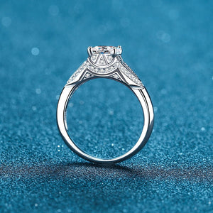 Silver ring with diamonds on a blue textured background