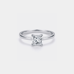 Silver ring with a princess-cut moissanite on a light gray background