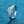 Silver ring with a diamond on a blue textured background