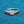 Silver ring with a diamond on a blue textured background