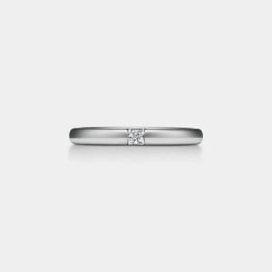 A gold-colored, solid 925 sterling silver wedding band ring with a princess cut moissanite gemstone on the top.