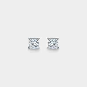 Pair of diamond stud earrings on a light gray background