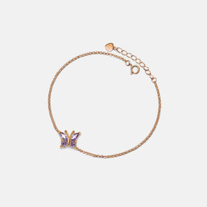 A gold-plated sterling silver bracelet with a hypoallergenic finish, featuring a purple amethyst butterfly charm and a adjustable chain.