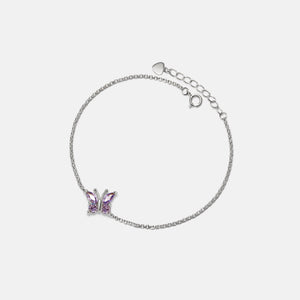 A gold-plated sterling silver bracelet with a hypoallergenic finish, featuring a purple amethyst butterfly charm and a adjustable chain.