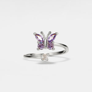 A gold-plated sterling silver ring with a bypass design featuring a butterfly motif and purple cubic zirconia stones.