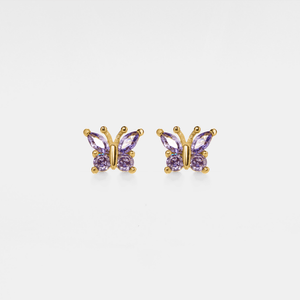 A pair of gold stud earrings in the shape of butterflies with purple cubic zirconia bodies.