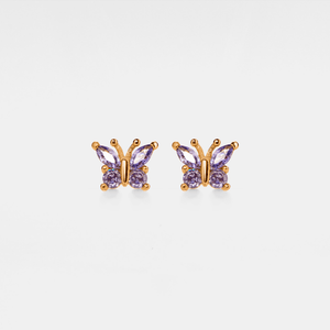 A pair of rose gold stud earrings in the shape of butterflies with purple cubic zirconia bodies.