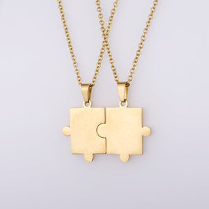 A collection of puzzle piece matching couple pendant necklaces in various colors including silver, gold, and rose gold.