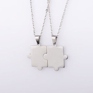 A collection of puzzle piece matching couple pendant necklaces in various colors including silver, gold, and rose gold.