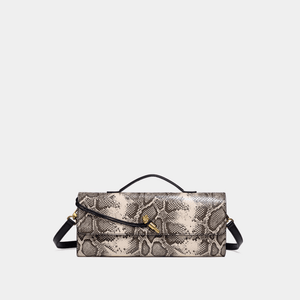 Snake print handbag on a light gray background