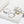 Silver hoop earrings with colorful beads on a white background