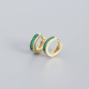 A pair of gold-plated huggie hoop earrings with multicolored gemstones
