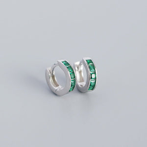 A pair of gold-plated huggie hoop earrings with multicolored gemstones