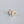 A pair of gold-plated huggie hoop earrings with multicolored gemstones