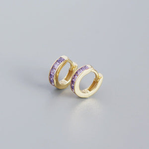 A pair of gold-plated huggie hoop earrings with multicolored gemstones