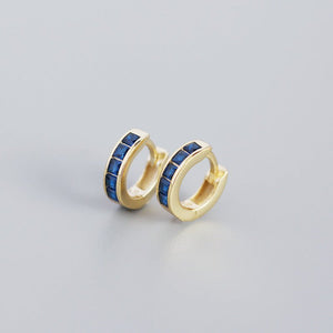 A pair of gold-plated huggie hoop earrings with multicolored gemstones
