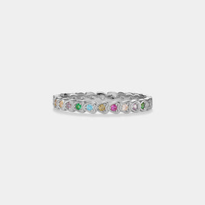 Silver ring with colorful gemstones on a white background