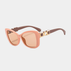 Sunglasses with pink frame and lenses on a light gray background