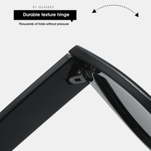 Close-up of a durable texture hinge on a black frame with text indicating its features.