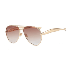 Gold-framed sunglasses with gradient lenses on a white background