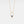 Gold necklace with a blue gemstone pendant on a light gray background