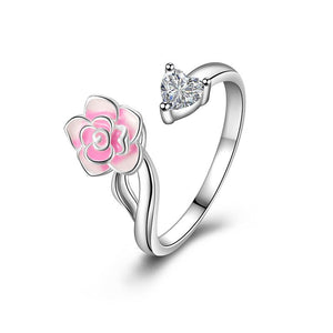 Adjustable sterling silver rings with rose flower designs, featuring red and pink enamel and a clear central gemstone.