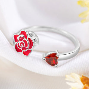Adjustable sterling silver rings with rose flower designs, featuring red and pink enamel and a clear central gemstone.