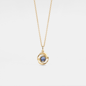 Gold necklace with a blue gemstone pendant on a light gray background