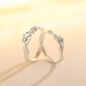 Silver ring with floral design on a soft yellow background