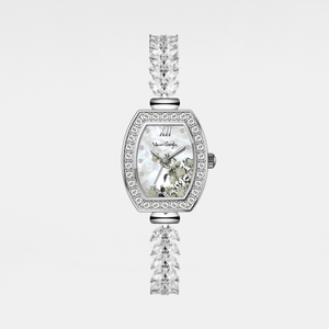 Silver watch with floral face and crystal accents on a light gray background