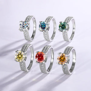 Set of six silver rings with colorful gemstones on a light gray background
