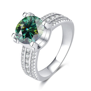 A collection of six moissanite cocktail rings with pave settings, displayed in a variety of colors including colorless, blue, yellow, red, and green.
