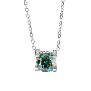 A round color moissanite pendant necklace with a red hue, set in a silver mounting on a chain.