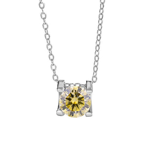 A round color moissanite pendant necklace with a red hue, set in a silver mounting on a chain.