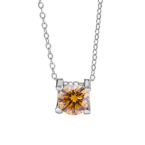 A round color moissanite pendant necklace with a red hue, set in a silver mounting on a chain.