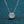 Diamond necklace on a dark blue textured background