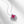 Silver necklace with a heart-shaped pendant featuring red gemstones on a light gray background