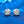 Pair of diamond stud earrings on a blue background