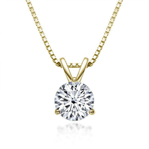 Gold necklace with a round diamond pendant on a white background