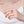 Close-up of a hand wearing a silver ring with a large gemstone on a plain background