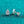 Teardrop-shaped diamond earring on a turquoise glittery background