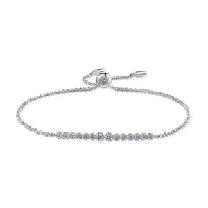 Silver bracelet with small round embellishments on a white background