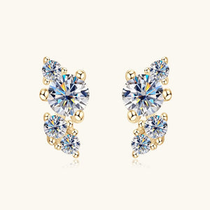 Gold and crystal earrings on a white background