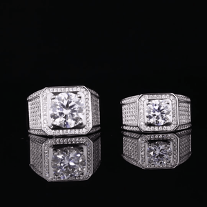 Pair of diamond stud earrings on a black background